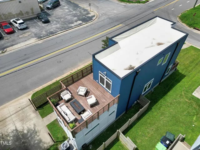 a front view of a house with a plants