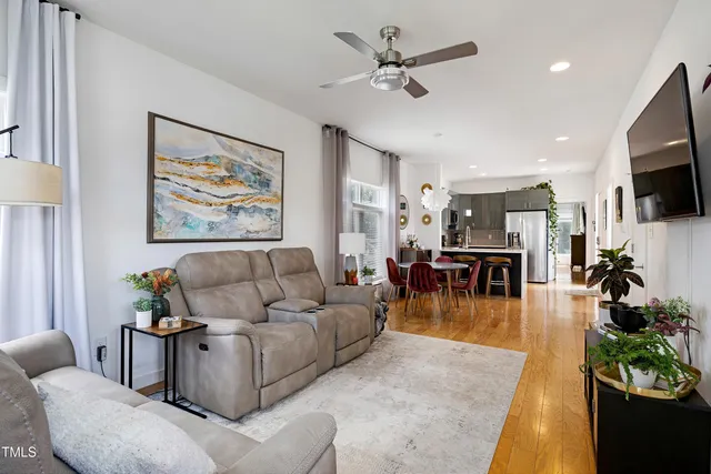 a view of a dining room with furniture and wooden floor