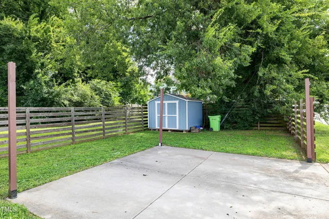 a view of a door and chair front of house