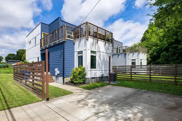 a view of a street with a tree