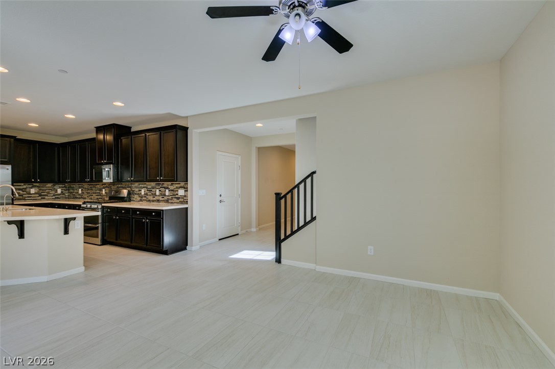 2549 Sable Ridge Street Henderson, NV 89044 - Photo 16 of 48 An open-concept layout unites the sleek kitchen with ample living space, perfect for entertaining.
