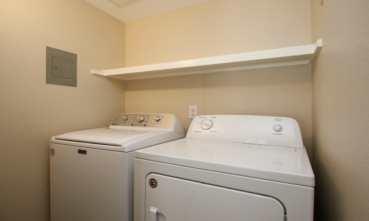 3500 Tangle Brush Drive, Unit 138 Spring, TX 77381 - Photo 18 of 28 Just across from the bedroom is a convenient laundry closet featuring full size machines; Both the washer and dryer stay with the unit! Washer replaced in 2024.