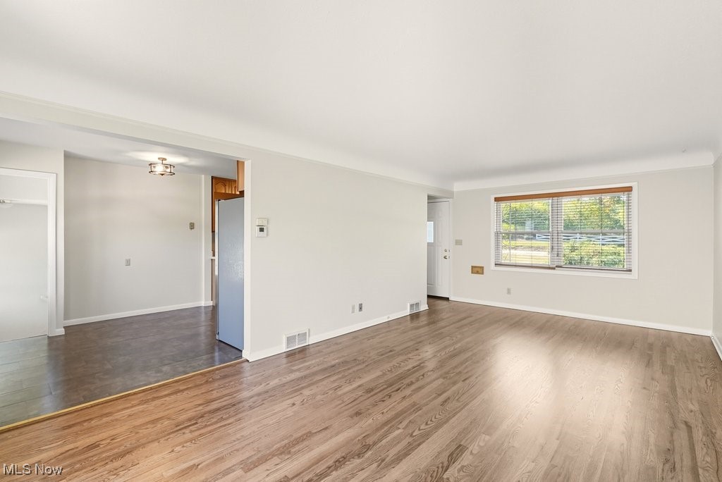 181 Boston Mills Road Hudson, OH 44236 - Photo 11 of 33 Spare room featuring wood finished floors and crown molding
