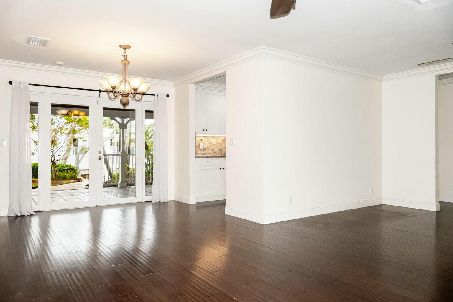 18014 Perigon Way Jupiter, FL 33458 - Photo 6 of 35 wooden floor in an empty room with a window