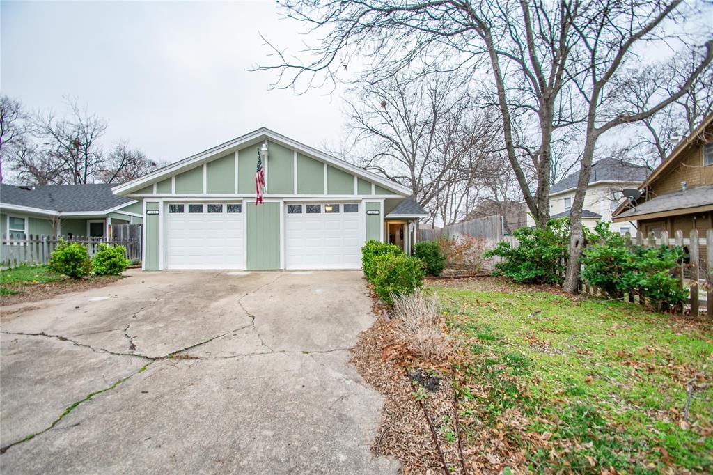 1817 Lipscomb Street Fort Worth, TX 76110 - Photo 1 of 10 View of front of property featuring a garage