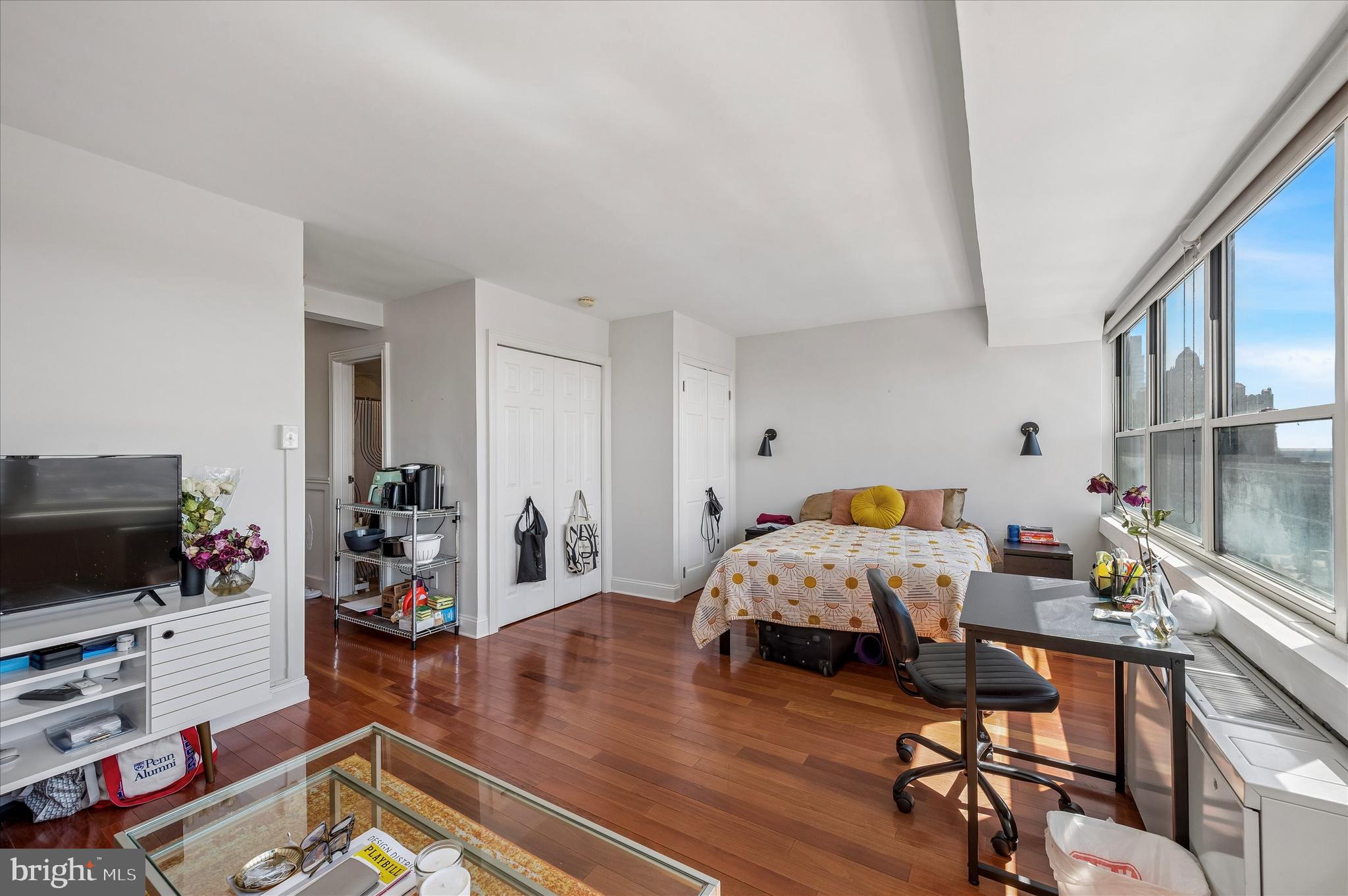 1810 Rittenhouse Square, Unit 2007 Philadelphia, PA 19103 - Photo 14 of 25 a bed room with furniture and a flat screen tv