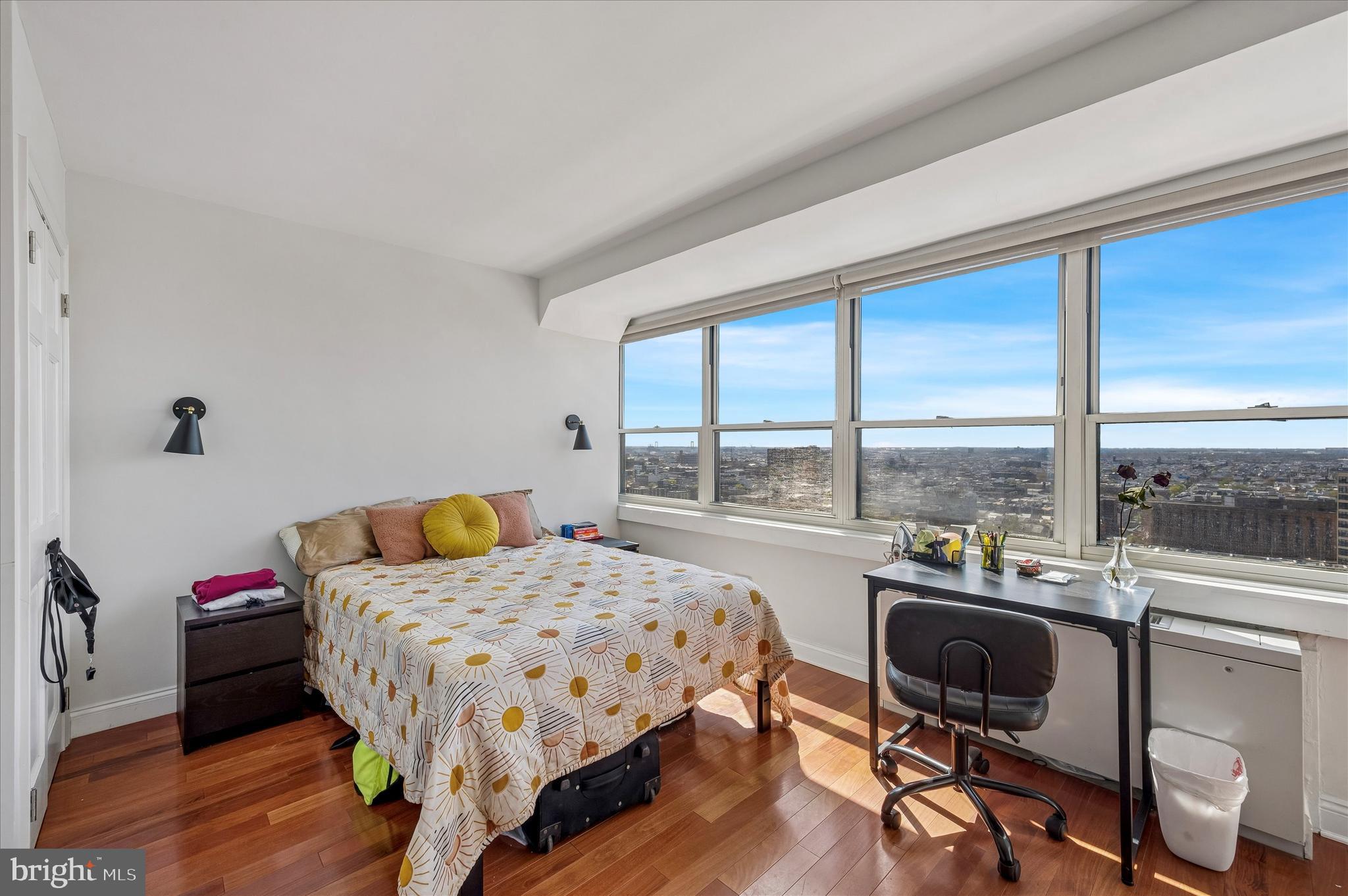 1810 Rittenhouse Square, Unit 2007 Philadelphia, PA 19103 - Photo 15 of 25 a bedroom with a bed chairs and a table