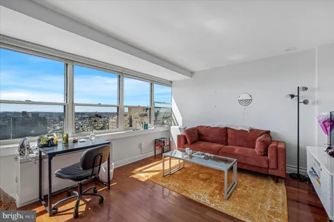 a living room with furniture and a large window