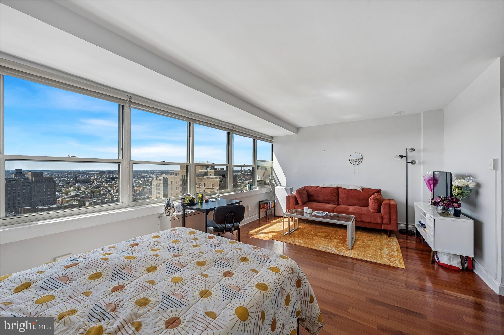 1810 Rittenhouse Square, Unit 2007 Philadelphia, PA 19103 - Photo 20 of 25 a bedroom with a bed and large windows