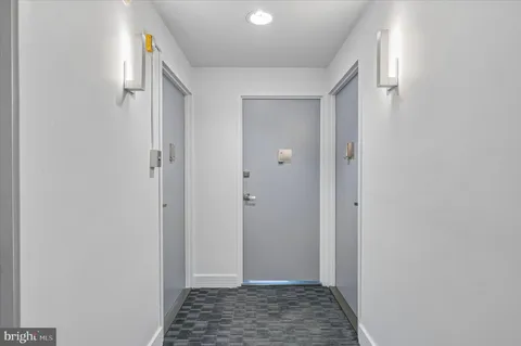 a view of hallway with walk in closet