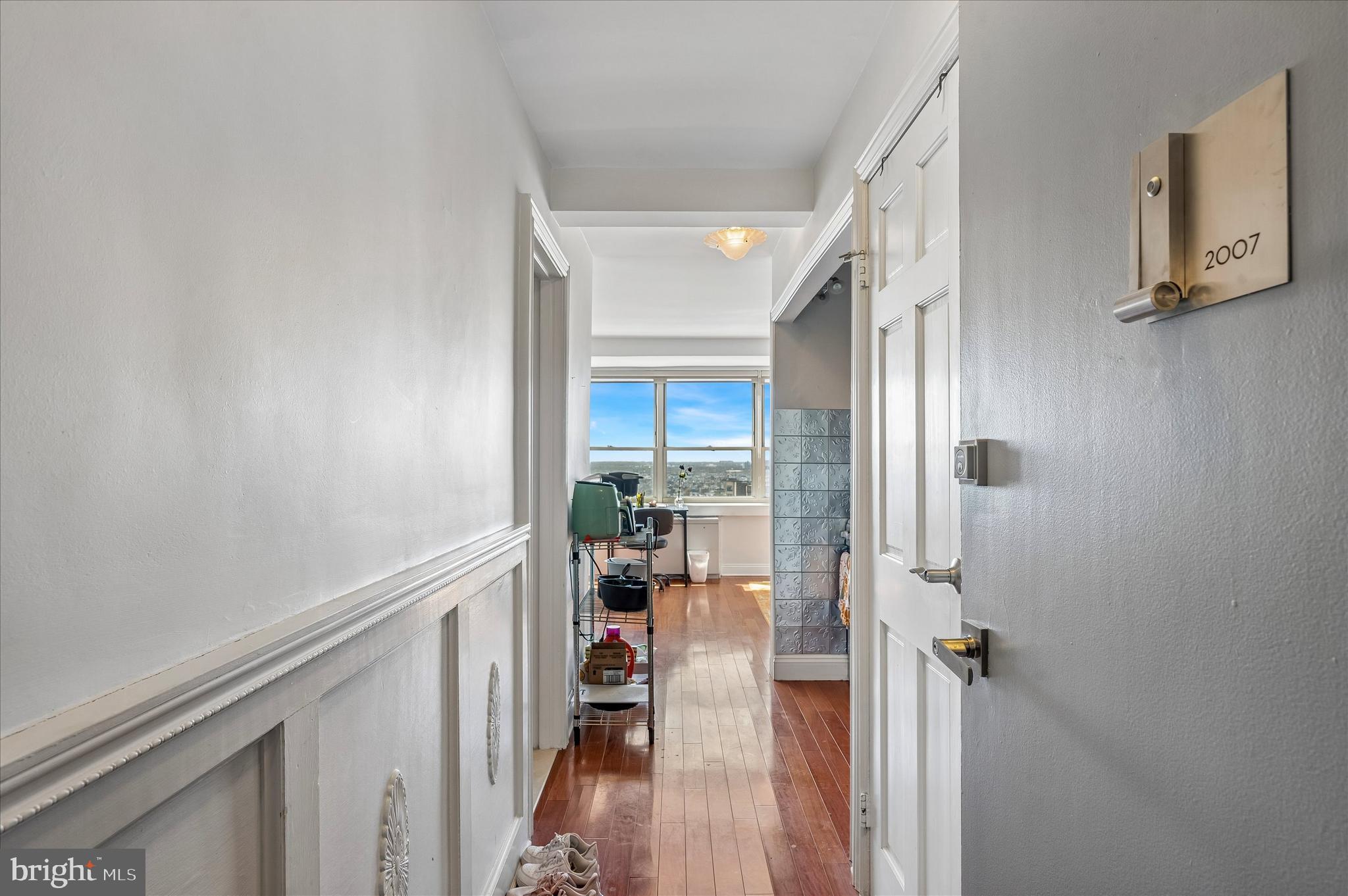 1810 Rittenhouse Square, Unit 2007 Philadelphia, PA 19103 - Photo 6 of 25 a view of a hallway with wooden floor and staircase