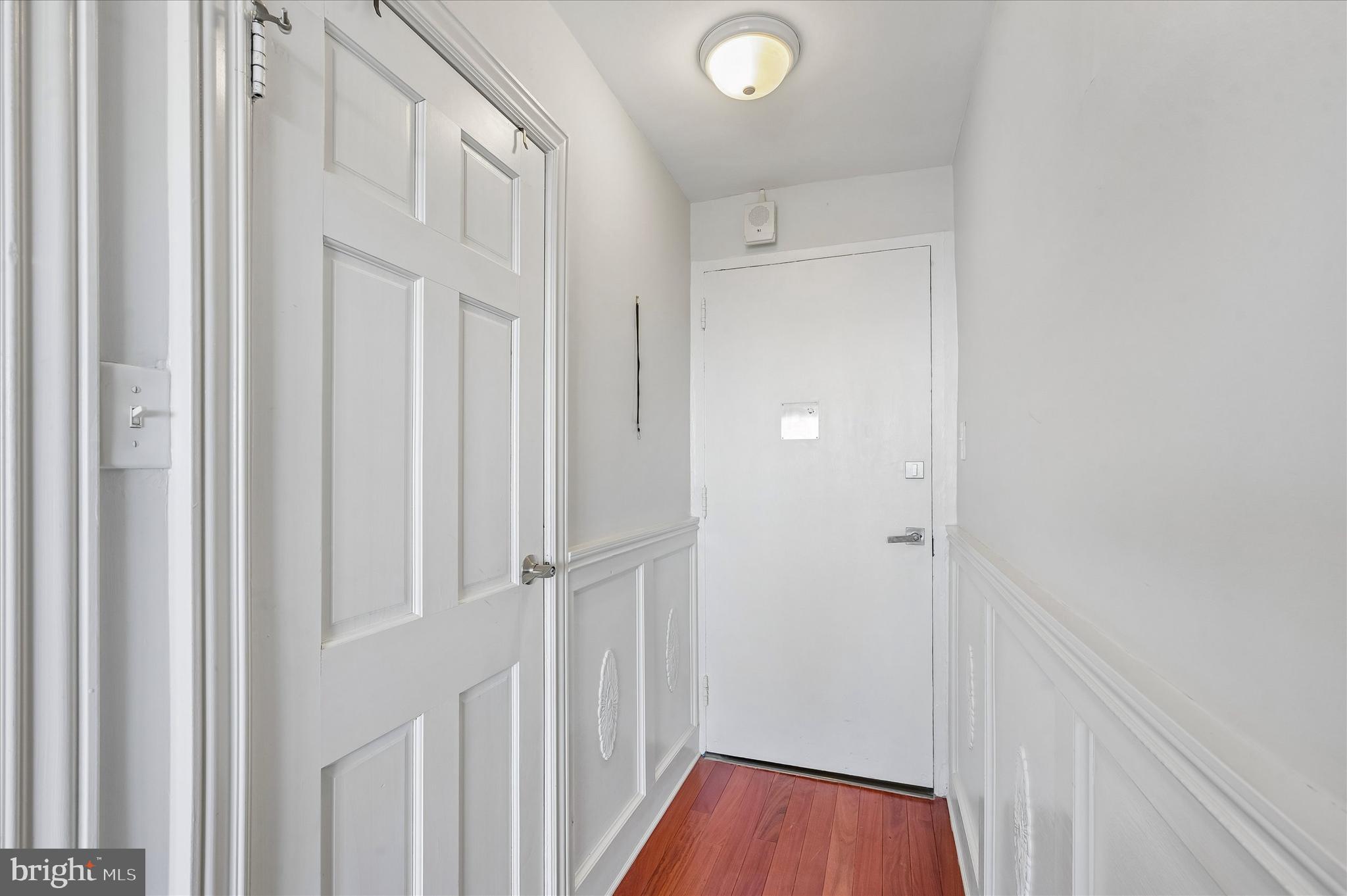 1810 Rittenhouse Square, Unit 2007 Philadelphia, PA 19103 - Photo 7 of 25 a view of a hallway with wooden floor and staircase