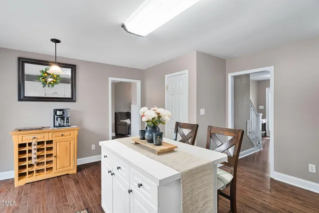a view of a dining room with furniture wooden floor and chandelier