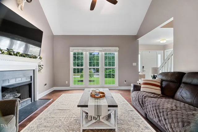a living room with furniture and a fireplace