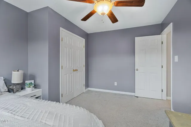 a bedroom with a bed and cabinets