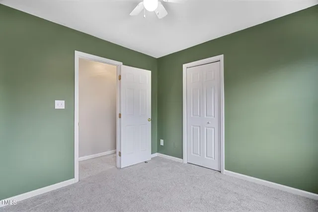 an empty room with a bathroom