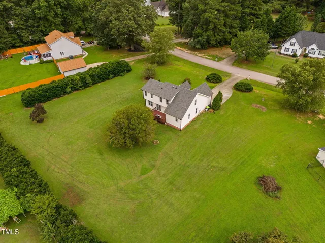 an aerial view of a house with a garden