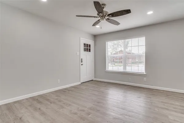 a view of an empty room with a window