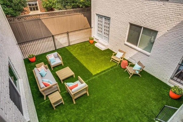 a view of backyard with a table and chairs