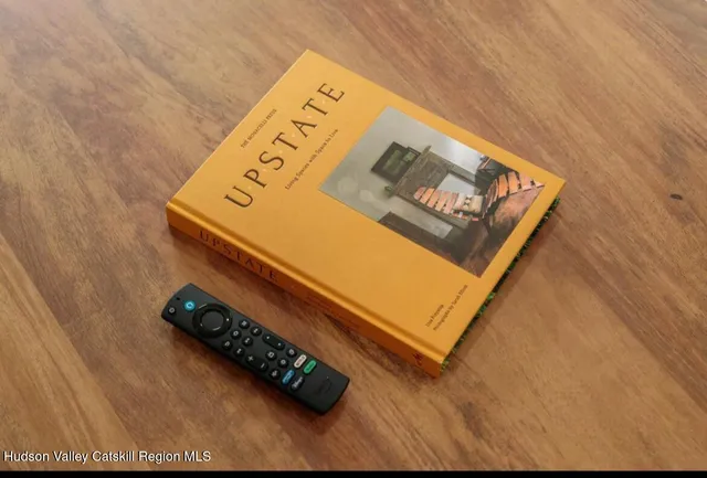 a bathroom with a bathtub and next to a window