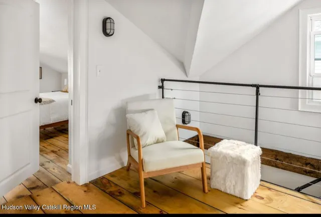 a view of bedroom with a bed and dresser
