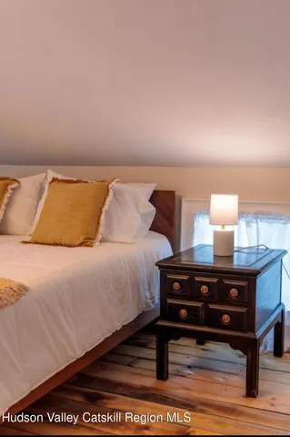 a bathroom with a mirror and a shower