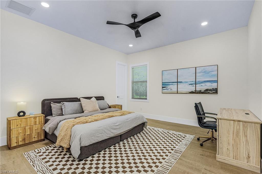 618 31st Street Northwest Naples, FL 34117 - Photo 22 of 47 a bedroom with a bed and window