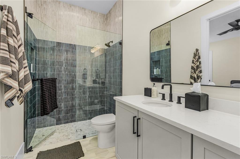 618 31st Street Northwest Naples, FL 34117 - Photo 23 of 47 a bathroom with a sink toilet and shower