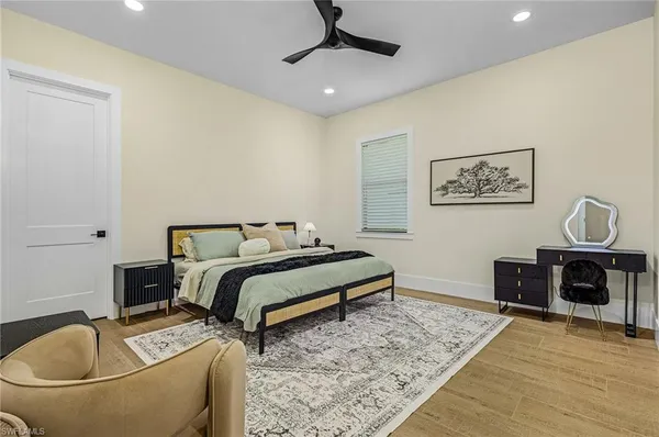 a bedroom with a bed and a couch