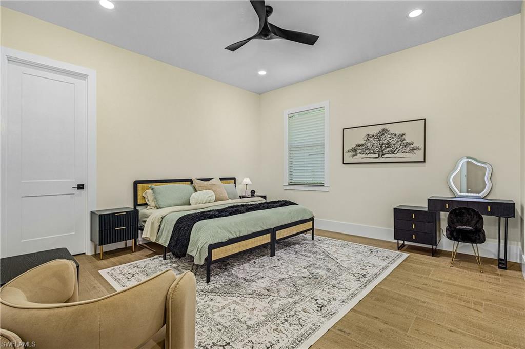 618 31st Street Northwest Naples, FL 34117 - Photo 24 of 47 a bedroom with a bed and a couch