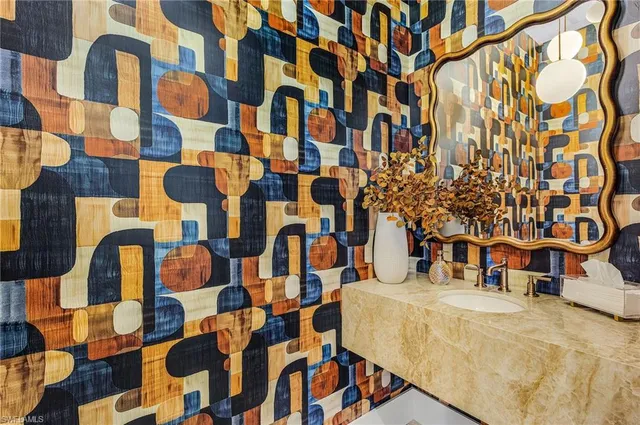 a bathroom with a sink and a shower curtain