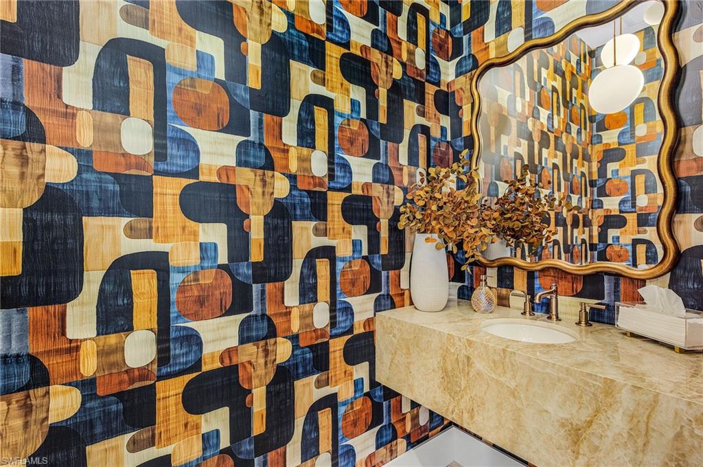 618 31st Street Northwest Naples, FL 34117 - Photo 27 of 47 a bathroom with a sink and a shower curtain