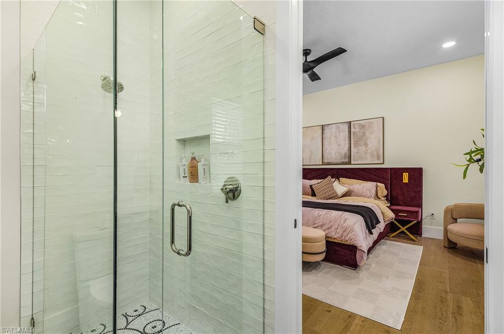 618 31st Street Northwest Naples, FL 34117 - Photo 30 of 47 a bedroom with a bed and a shower