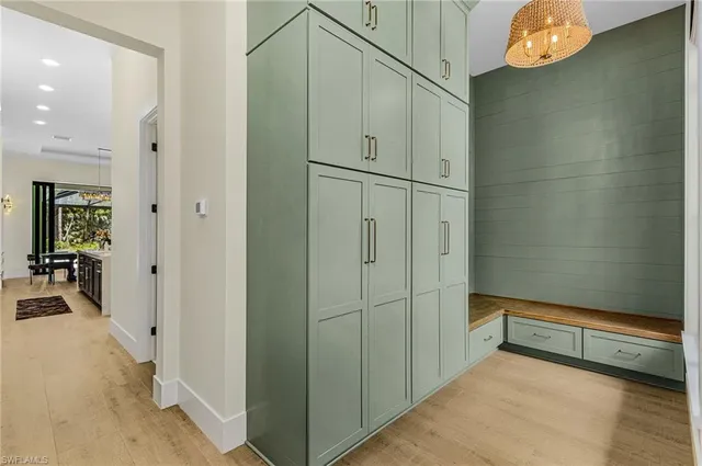 a view of hallway with chandelier