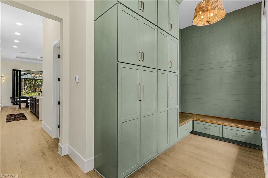 618 31st Street Northwest Naples, FL 34117 - Photo 31 of 47 a view of hallway with chandelier