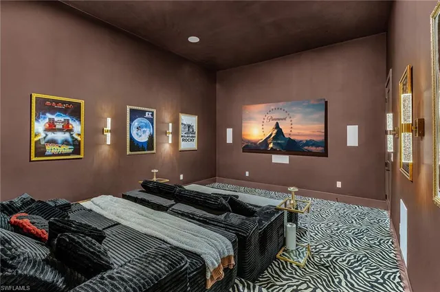 a bedroom with bed and a flat screen tv