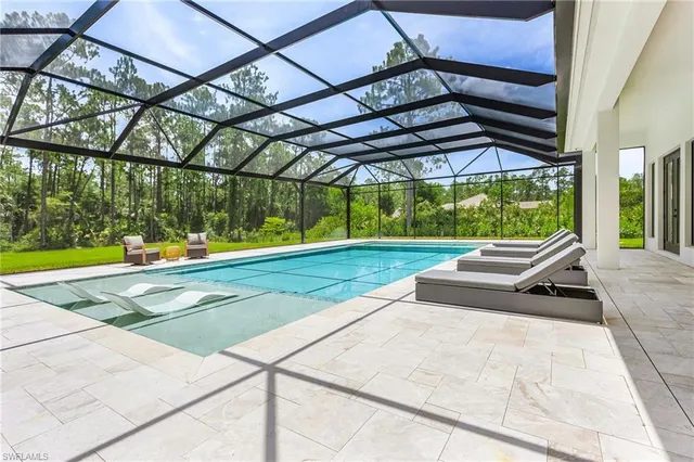 a view of a swimming pool with a backyard