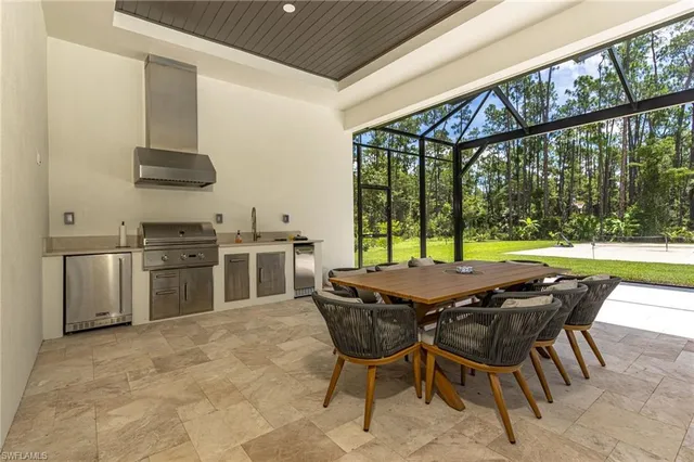 a kitchen with a stove a sink and a refrigerator