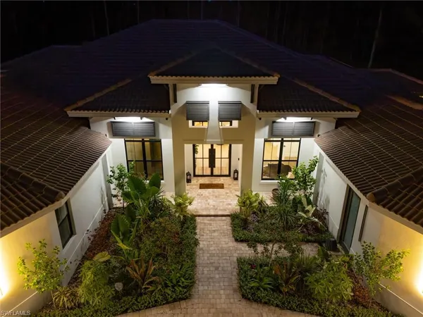 a view of a porch with a potted plant