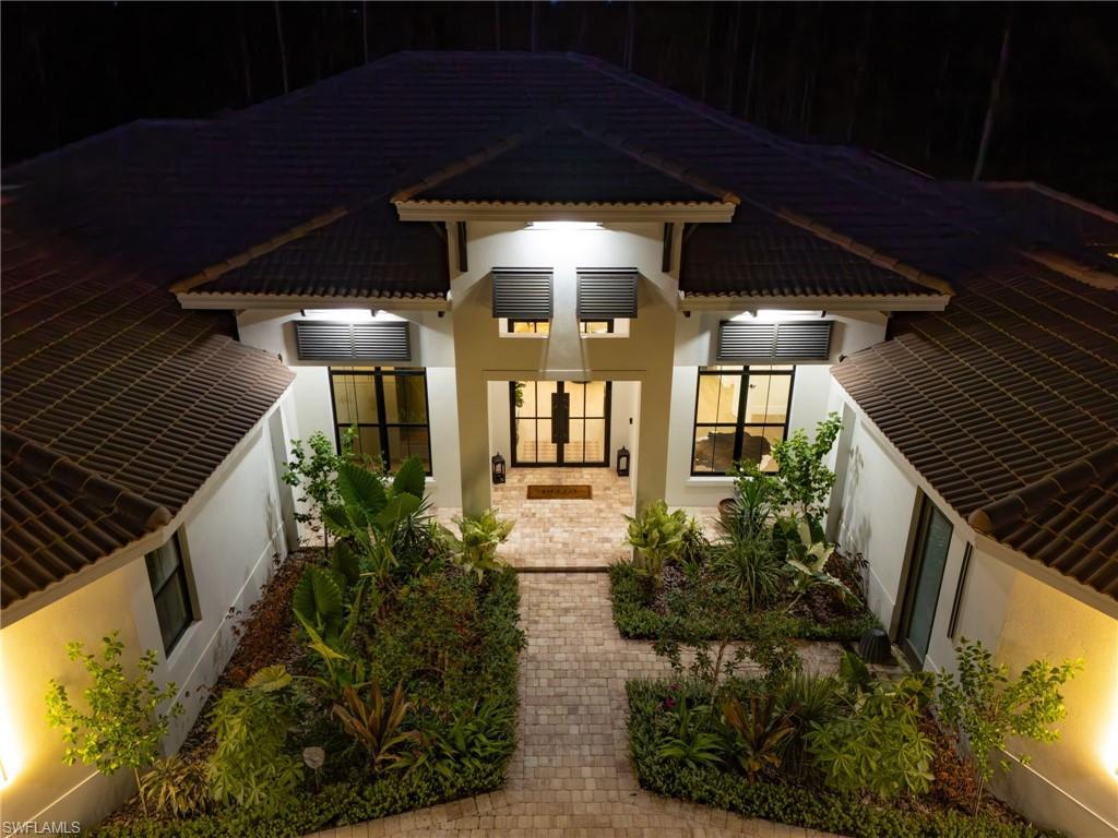 618 31st Street Northwest Naples, FL 34117 - Photo 47 of 47 a view of a porch with a potted plant