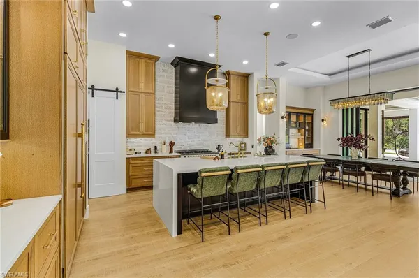 a bathroom with a sink a mirror and a shower