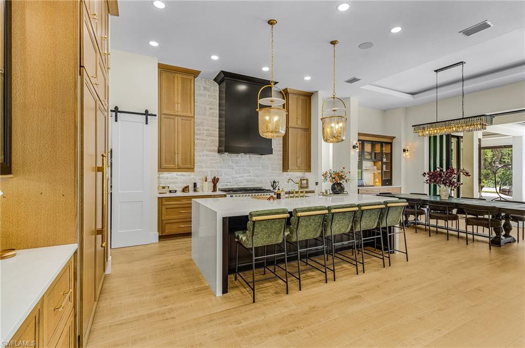 618 31st Street Northwest Naples, FL 34117 - Photo 7 of 47 a bathroom with a sink a mirror and a shower