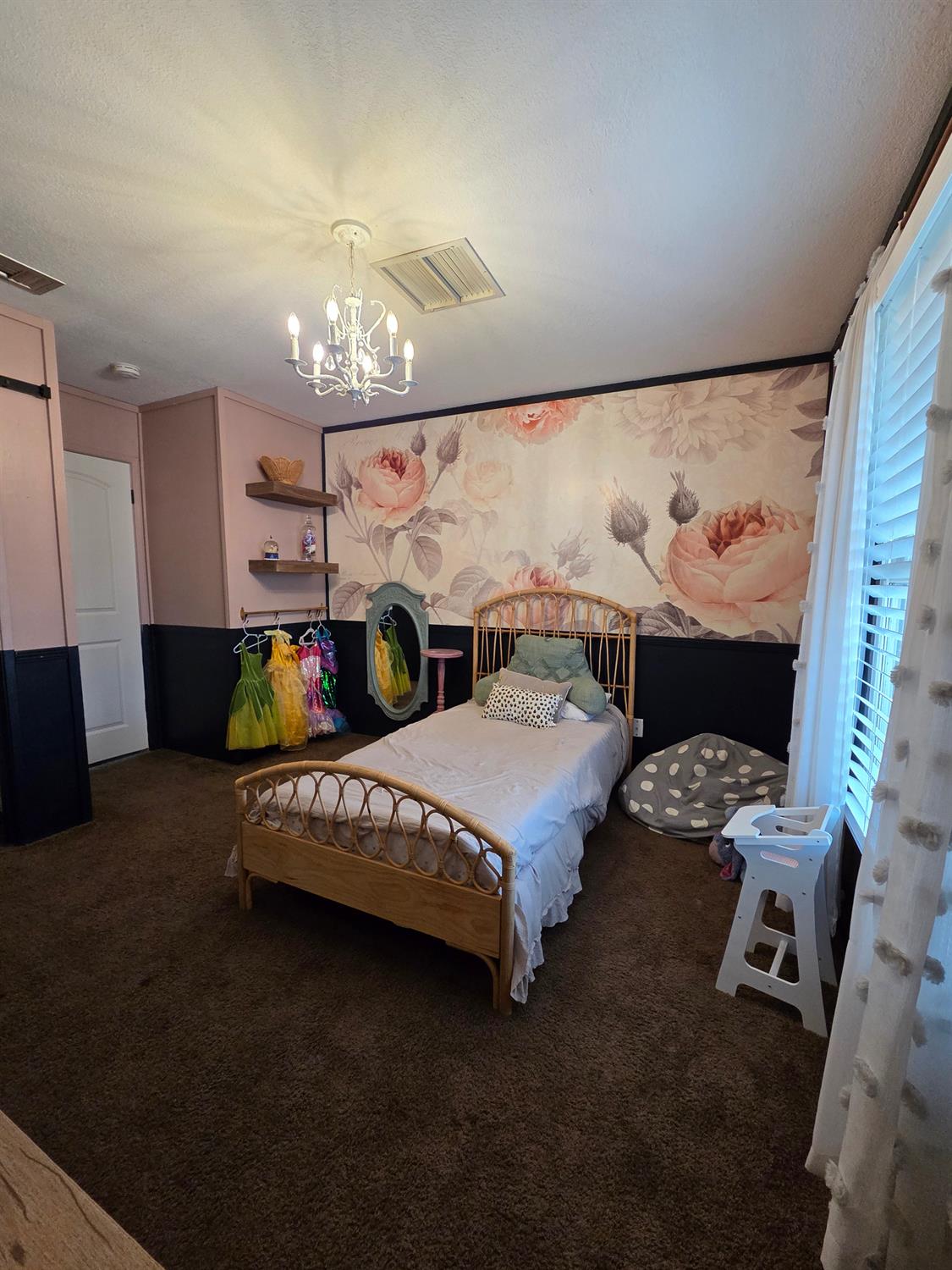 22849 East Jefferson Avenue Reedley, CA 93654 - Photo 15 of 31 a spacious bedroom with a bed and a chandelier