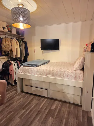 a bathroom with a double vanity sink and a mirror