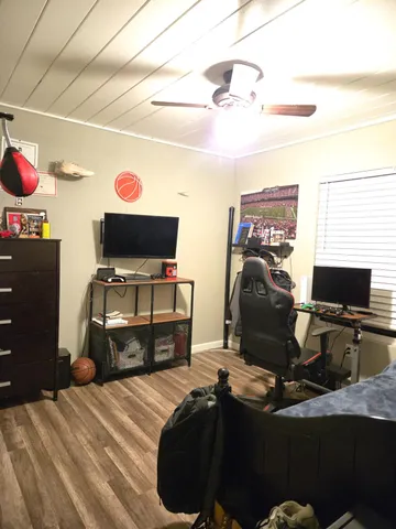 a bedroom with bed and window