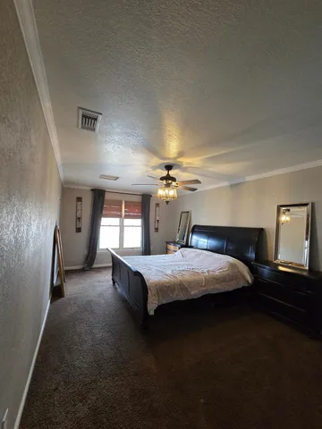 a view of a patio with table and chairs with wooden floor and fence