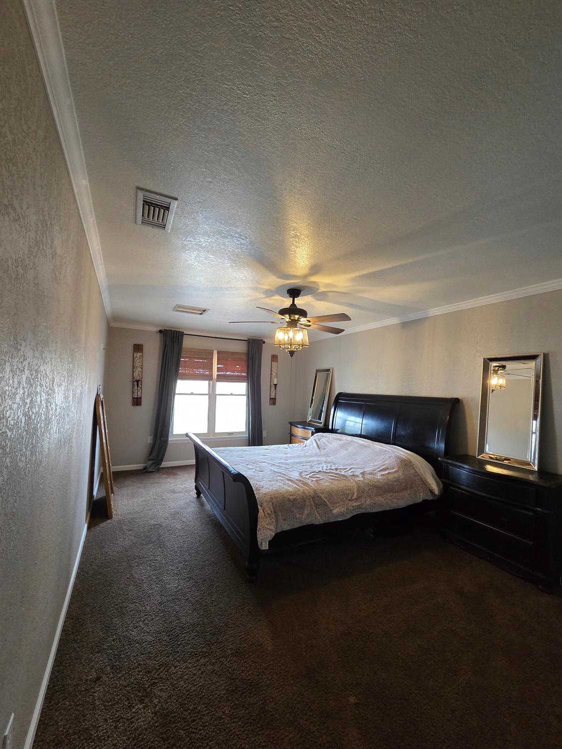 22849 East Jefferson Avenue Reedley, CA 93654 - Photo 20 of 31 a bedroom with bed and window