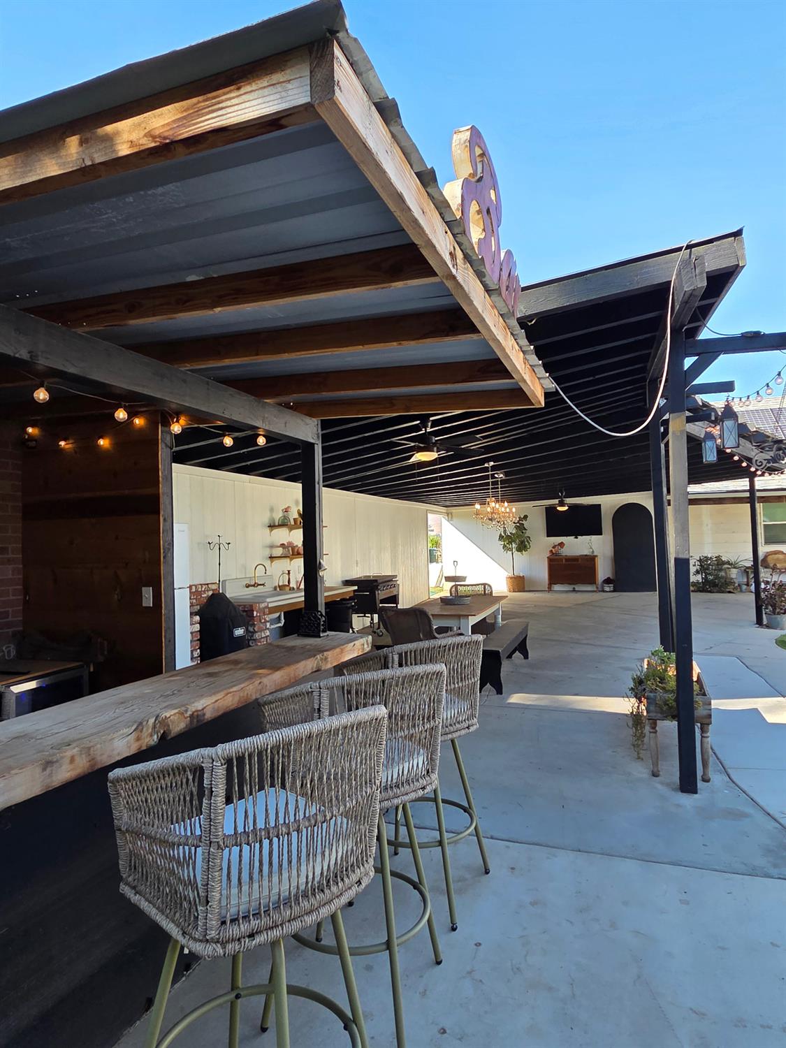 22849 East Jefferson Avenue Reedley, CA 93654 - Photo 22 of 31 a view of a patio with table and chairs with wooden floor and fence
