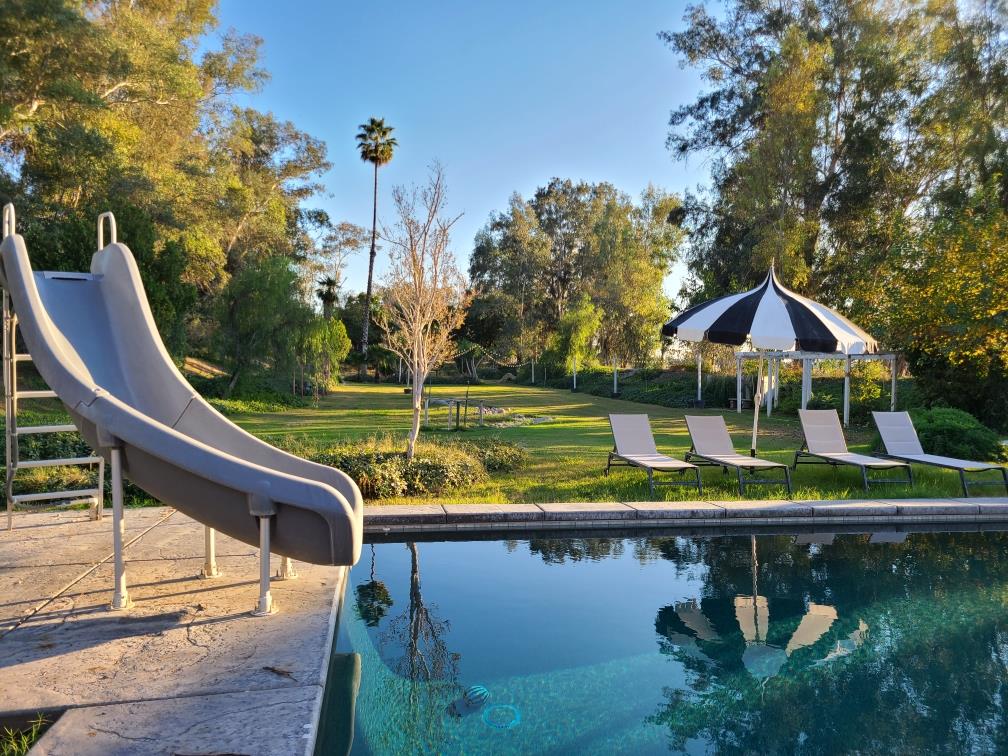 22849 East Jefferson Avenue Reedley, CA 93654 - Photo 28 of 31 a view of house with swimming pool and outdoor seating