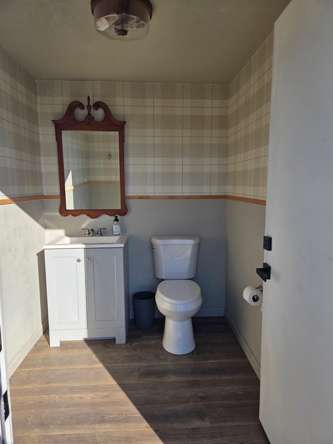 22849 East Jefferson Avenue Reedley, CA 93654 - Photo 31 of 31 a bathroom with a toilet and a sink
